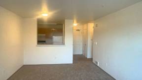 Empty room with a window and a door.