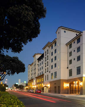 A long building with lights on the front.