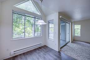 A room with a large window and a skylight.