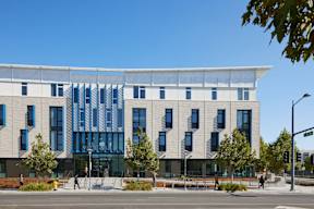 A modern building with a white and blue facade.