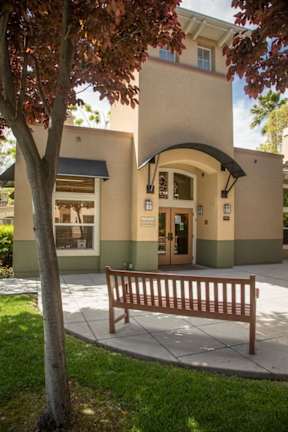 A building with a bench in front of it.