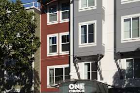 A building with a sign that says "ONE CHURCH".