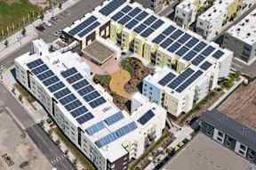A modern building with solar panels on the roof.