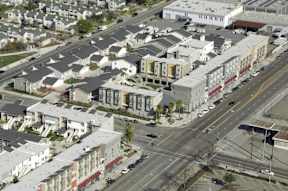 A city street with buildings and cars.