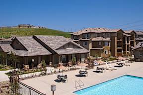 A large building with a pool in front.