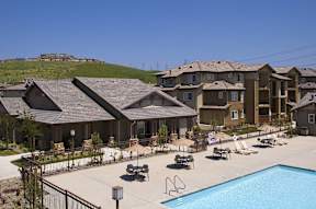 A large building with a pool in front.