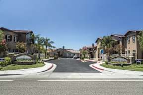 A street view of a residential area with the name "MADERA VISTA" on the sign.