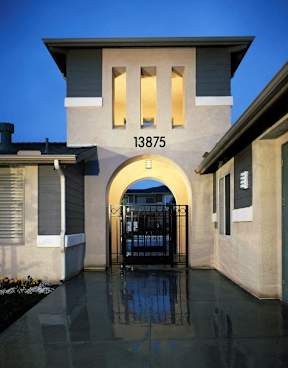 A house numbered 13875 is shown with a gate and a wall.