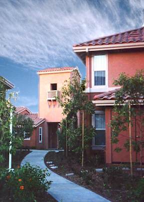 A red house with a white door and windows.