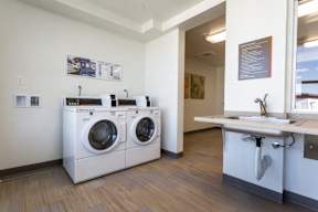 A laundry room with a washer and dryer.