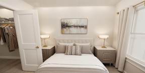 Elegantly designed bedroom at Contrast OTR in Cincinnati, Ohio, featuring neutral tones, modern furnishings, a spacious walk-in closet, and ample natural light