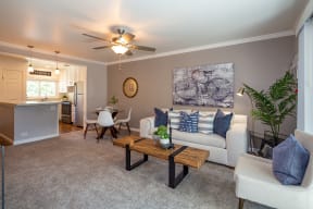 Apartments Near BART- Walnut Hill- Living Room with Carpeting, Neutral Furniture, and Ceiling Fan