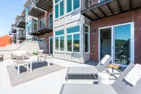 Pet-Friendly Apartments in San Rafael, CA - Community Rooftop Lounge Area with Tables, Seating and City Views