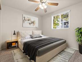 A bedroom with a large bed and a ceiling fan at ALTITUDE BY VINTAGE,  89523