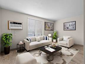 A living room with a couch, chair, and potted plant at ALTITUDE BY VINTAGE, Nevada, 89523