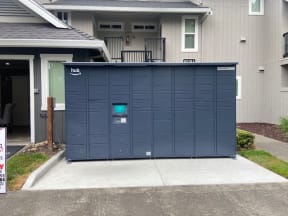 a large blue garage door in front of a house