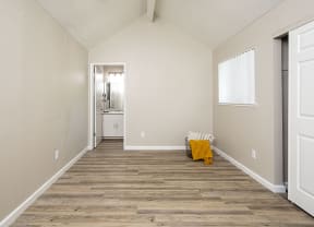2 BR Apartments in Rohnert Park CA - Americana - Large Bedroom with Wood Plank Flooring, Oversized Closet, and Attached Bathroom