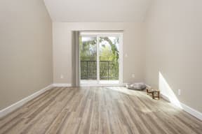 Light and bright living area with balcony and window coverings