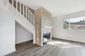 Fireplace near stairs in living room