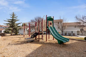 Three BR Apartments in Reno NV - Altitude by Vintage - Playground with a Jungle Gym, Green Slides, and Landscaping