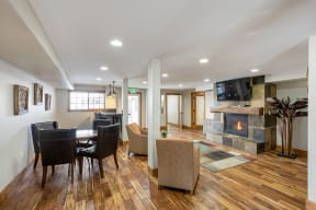 Apartments for Rent in Reno NV - Altitude by Vintage - Lounge-Area with Fireplace, Wood Style Flooring, Seating Areas, and a TV