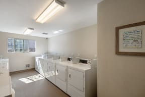 Reno NV Apartments - Altitude by Vintage - Laundry-Facilities with Full Washers and Dryers, a Window, and Bright Fluorescent Lighting