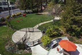 Campbell Apartments For Rent - Gated Dog Park With Paved Walkways, Equipment, And Greenery