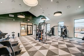 Reno Apartments- Westlook- Fitness Machines with Floor-to-Ceiling Windows and Free Weights