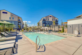 Apartments for Rent in Reno, NV0- Westlook- Resort-Style Pool with Umbrellas over Sun Lounge Chairs and Cabanas