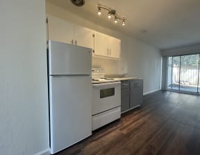 Apartments in North Oakland CA - Open Layout Kitchen Fully Equipped with Convenient Amenities Such As Fridge and Stove