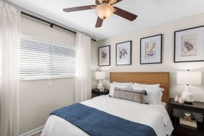 a bedroom with a bed and a ceiling fan at The Bentley at Maitland, ORLANDO, 32810