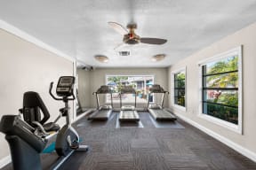 a gym with cardio machines and a ceiling fan at The Bentley at Maitland, ORLANDO Florida