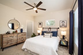 Sparks Apartments - High Rock 5300 - Oversized Bedroom with Carpeted Floors, Modern Ceiling Fan, Large Window, and Queen Bed