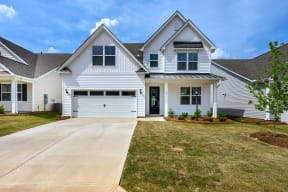 2-story white home with 2-car garage