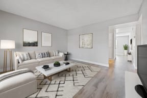 Apartments for Rent in Colton - Ardella at Reche Canyon - Modern Living Room with Wood-Style Flooring