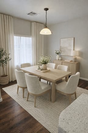 A dining room with a wooden table and chairs.