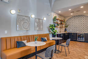 A modern dining area with a round table and chairs.