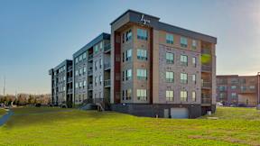 A modern apartment building with the name
