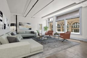 Lofts Downtown LA CA - Santa Fe Lofts - Living Room with Sectional, Coffee Table, Two Chairs, Area Rug, Lamp, and Floor-to-Ceiling Windows.