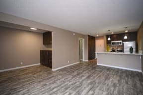 Studios in Chatsworth CA - Waterstone - Open Concept Living Room with Wood-Style Flooring and Access to the Kitchen