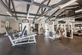 an image of a gym with weights and other exercise equipment