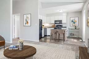 A modern kitchen with a dining table and chairs.