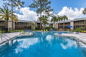 A large swimming pool with a metal fence around it.