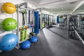 a workout room with weights and other exercise equipment