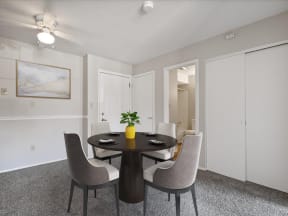 our apartments offer a dining room with a table and chairs