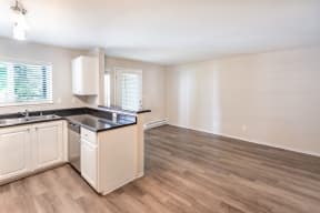 a kitchen and living room in an apartment