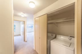 a room with a washer and dryer in it