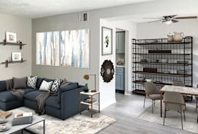 a living room with a blue couch and a dining room table