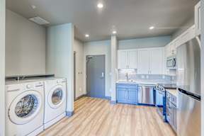 A laundry room with a washer and dryer.