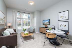 Living room with large window and plush carpeting for you